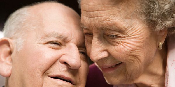 Elderly couple smiling together